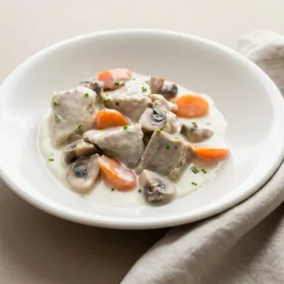 blanquette de veau etchebest finished dish with a golden topping